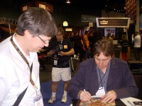 Allan writing autographs at NAMM 2009