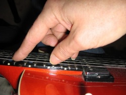 Plaing an artificial harmonic