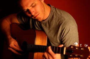 A guitar student practicing